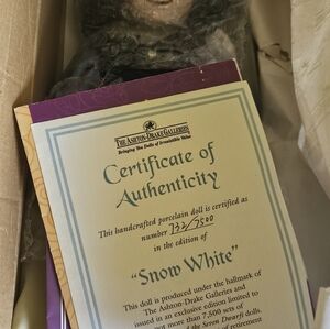 Snow white porcelain doll, and dwarfs ,4 brand new in boxes Vintage